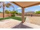 Covered patio overlooking backyard pool and grassy area at 11543 E Quade Ave, Mesa, AZ 85212