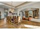 Expansive dining room flowing into living area with a large table and comfortable seating arrangement at 10911 E Taos Dr, Scottsdale, AZ 85262