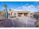 Landscaped backyard with patio and desert plants at 19661 N Echo Rim Dr, Surprise, AZ 85387