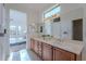 Double vanity bathroom with view of bedroom at 19661 N Echo Rim Dr, Surprise, AZ 85387