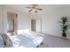 Bedroom with gray bed and ceiling fan at 19661 N Echo Rim Dr, Surprise, AZ 85387