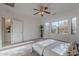 Bright bedroom with large window and ceiling fan at 19661 N Echo Rim Dr, Surprise, AZ 85387