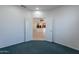 Bedroom with view into kitchen and tile flooring at 19661 N Echo Rim Dr, Surprise, AZ 85387