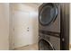 Laundry room with stacked LG washer and dryer at 19661 N Echo Rim Dr, Surprise, AZ 85387