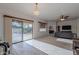 Open living room with high ceiling, chandelier and sliding glass door to backyard at 19661 N Echo Rim Dr, Surprise, AZ 85387