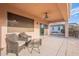 Covered patio with ceiling fan and seating area at 19661 N Echo Rim Dr, Surprise, AZ 85387