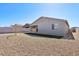 Gravel and grass complement the backyard, complete with block fencing at 4244 E Bradford Ave, San Tan Valley, AZ 85140