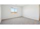 Bright bedroom with neutral carpet and a view out the window at 4244 E Bradford Ave, San Tan Valley, AZ 85140