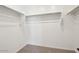 A simple walk-in closet with carpet and white walls and shelving at 4244 E Bradford Ave, San Tan Valley, AZ 85140