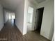 Bright hallway with tile flooring leading to bedrooms and living areas at 4244 E Brook Lynn Pl, San Tan Valley, AZ 85140