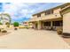 Expansive backyard featuring a large patio area, ideal for outdoor gatherings and activities with plenty of space at 5312 N Sierra Hermosa Ct, Litchfield Park, AZ 85340