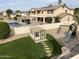 Spacious backyard with swimming pool, playground, and shed, perfect for Gathering fun and outdoor activities at 5312 N Sierra Hermosa Ct, Litchfield Park, AZ 85340