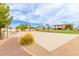 Spacious basketball court for sports and recreation amidst lush landscaping and clear blue skies at 5312 N Sierra Hermosa Ct, Litchfield Park, AZ 85340