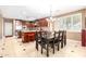 Stylish dining area adjacent to the kitchen, featuring elegant chairs and a chandelier at 5312 N Sierra Hermosa Ct, Litchfield Park, AZ 85340