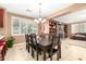 Formal dining room featuring decorative dark wood table and hutch in a homey setting at 5312 N Sierra Hermosa Ct, Litchfield Park, AZ 85340