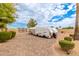 Long brick driveway leading to a covered boat or RV, offering ample parking and storage space at 5312 N Sierra Hermosa Ct, Litchfield Park, AZ 85340