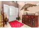 Welcoming foyer with elegant decor, a beautiful cabinet and a striking mirror at 5312 N Sierra Hermosa Ct, Litchfield Park, AZ 85340