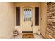 Charming front entrance with a decorative door, sidelights, and a welcoming 'welcome' mat at 5312 N Sierra Hermosa Ct, Litchfield Park, AZ 85340
