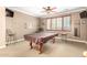 Entertaining game room featuring a pool table, comfortable seating, and stylish decor at 5312 N Sierra Hermosa Ct, Litchfield Park, AZ 85340