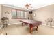 Game room featuring a pool table, comfortable seating, with a window that offers natural light at 5312 N Sierra Hermosa Ct, Litchfield Park, AZ 85340