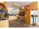 Organized garage space with ample shelving, a work area, and a clean, functional layout at 5312 N Sierra Hermosa Ct, Litchfield Park, AZ 85340