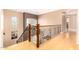 Bright hallway features light wood floors and a staircase with decorative iron railing at 5312 N Sierra Hermosa Ct, Litchfield Park, AZ 85340