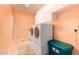Well-lit laundry room with modern washer and dryer, storage cabinets, and functional design at 5312 N Sierra Hermosa Ct, Litchfield Park, AZ 85340