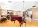 Bright living room with hardwood floors, comfortable seating, and staircase access at 5312 N Sierra Hermosa Ct, Litchfield Park, AZ 85340