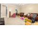 playroom with various toys, seating, and access to a walk-in closet at 5312 N Sierra Hermosa Ct, Litchfield Park, AZ 85340