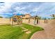 Backyard with a playground and a storage shed, great for outdoor fun and storage solutions at 5312 N Sierra Hermosa Ct, Litchfield Park, AZ 85340