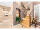 Elegant staircase featuring decorative iron railings and a niche with artwork at 5312 N Sierra Hermosa Ct, Litchfield Park, AZ 85340