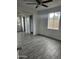 Bedroom with gray tile floors and large window at 2209 E Sheridan St, Phoenix, AZ 85006