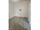 Simple bedroom with tile flooring and window air conditioner at 2209 E Sheridan St, Phoenix, AZ 85006