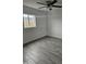 Simple bedroom with gray tile floors and a ceiling fan at 2209 E Sheridan St, Phoenix, AZ 85006