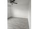 Spacious bedroom with gray tile floors and ceiling fan at 2209 E Sheridan St, Phoenix, AZ 85006