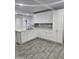 Modern kitchen with white cabinets and gray tile floor at 2209 E Sheridan St, Phoenix, AZ 85006