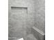 Modern shower with gray tile, built-in seat, and niche at 2209 E Sheridan St, Phoenix, AZ 85006