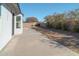 Backyard with a large concrete patio and established shrubs at 9127 W Banff Ln, Peoria, AZ 85381