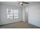 Spacious bedroom with new carpet and large window at 9127 W Banff Ln, Peoria, AZ 85381