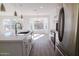 Modern kitchen with stainless steel appliances and white cabinets at 9127 W Banff Ln, Peoria, AZ 85381