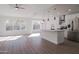 Bright and airy living room with laminate flooring and kitchen island at 9127 W Banff Ln, Peoria, AZ 85381