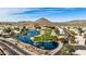 Community overview with lake, golf course, and surrounding houses at 21956 N 59Th Ln, Glendale, AZ 85310