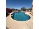 Inviting backyard pool featuring pristine blue water and surrounding concrete patio for outdoor relaxation and enjoyment at 21956 N 59Th Ln, Glendale, AZ 85310