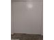 Neutral-toned, sliding closet doors offer convenient storage in a carpeted room at 3345 E University Dr # 25, Mesa, AZ 85213