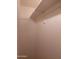 Interior closet with shelf and metal bar for ample hanging storage at 3345 E University Dr # 25, Mesa, AZ 85213
