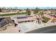 House with solar panels, view of the golf course, and surrounding neighborhood at 18822 N Grandview Dr, Sun City West, AZ 85375