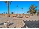 Landscaped backyard with patio and walkway, golf course view at 18822 N Grandview Dr, Sun City West, AZ 85375