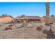 Spacious backyard with gravel landscaping, patio, and seating area at 18822 N Grandview Dr, Sun City West, AZ 85375