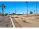 Backyard view of golf course beyond a fence at 18822 N Grandview Dr, Sun City West, AZ 85375