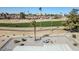 Backyard with gravel landscaping, a patio, and a view of a golf course at 18822 N Grandview Dr, Sun City West, AZ 85375